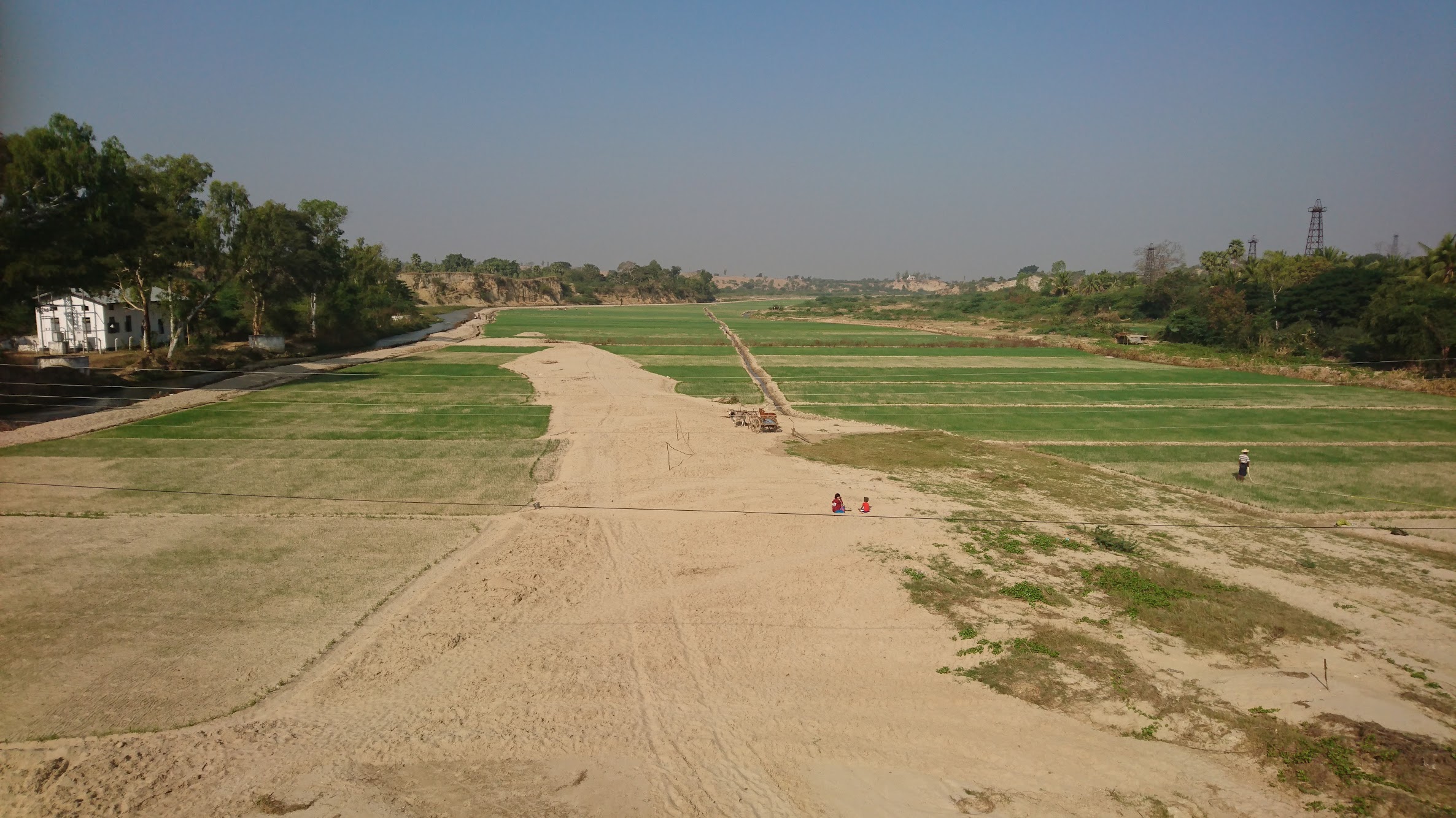 All the rivers are dried up at the moment, so locals are taking advantage of the newly formed land to dig for...something.