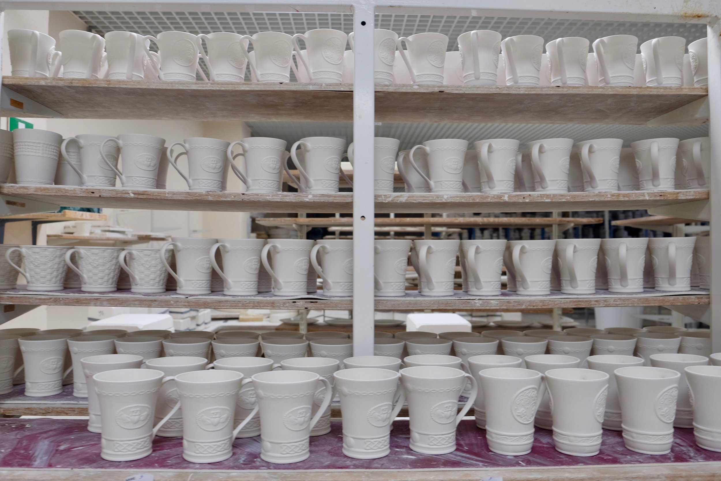 At this stage, the product is known as "Green Ware". This is also when assemblage such as adding a handle and spout for a teapot is done. After 24 hours of drying, you're left with a very chalky white delicate piece that's known as "White Ware", and this is also when fettling takes place - using sharp tools to remove any excess clay, raw edges, and other imperfections before the first firing.