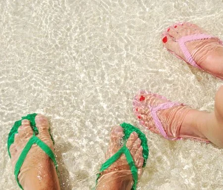 5480421_S_Flip_flops_two_pair_water_sun_women_feet_toes_nails.jpg