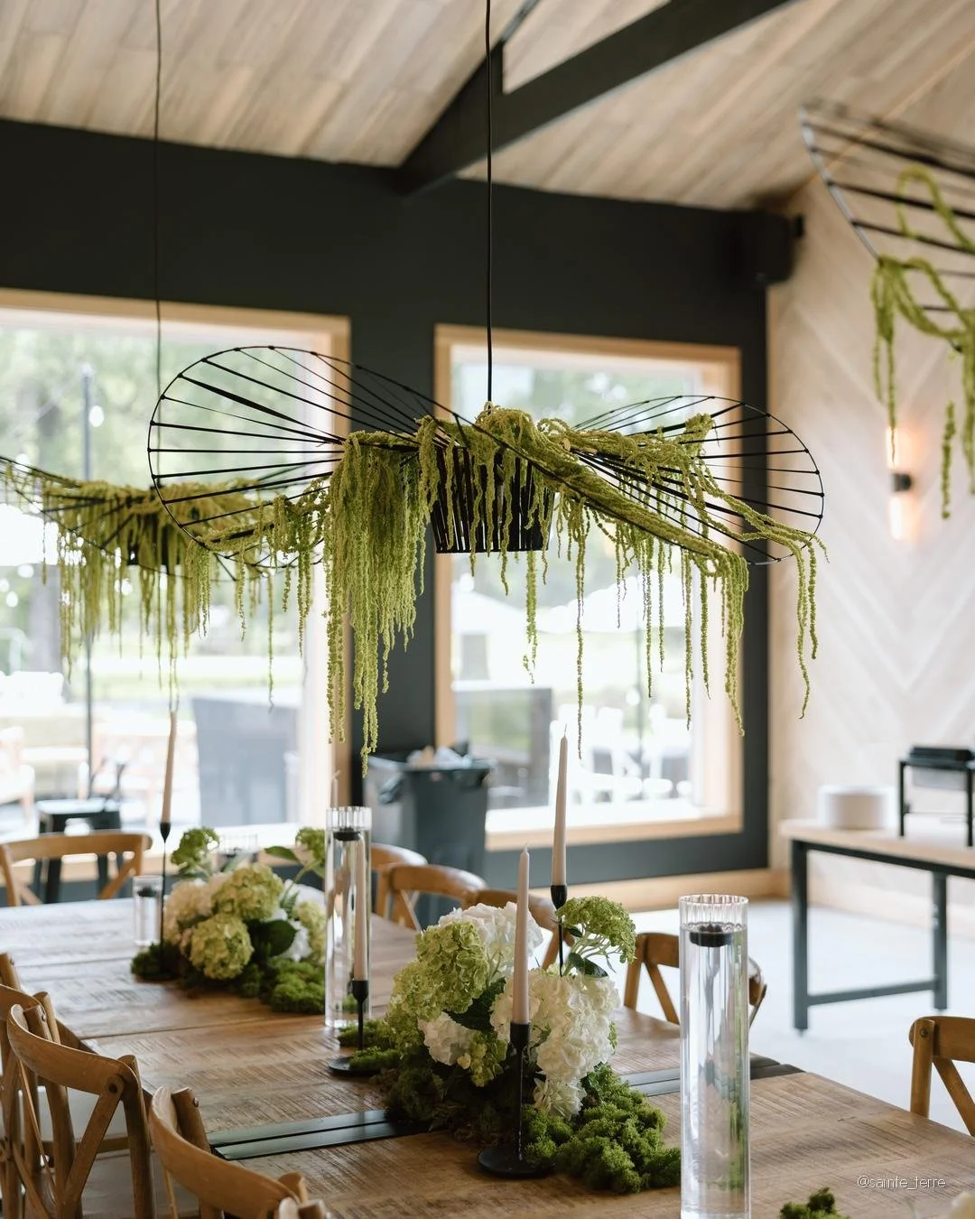 This is what happens when the bride says "I trust you."

Hillary created the design concept from the ground up &mdash; black, white, and green. Black metal hoops suspended over the long tables with green amaranthus draping down. Black candl