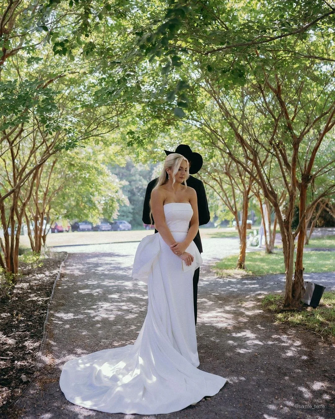Before the aisle. 
Before the final touch ups. 
Before the guests took their seats...
Peyton and Blaise stood back-to-back under the crepe myrtles and read their vows to each other.
Not the public ones. The private ones.

We love this tradition. Ther