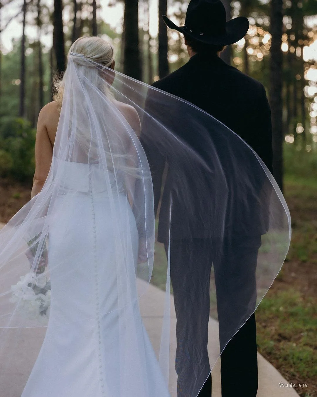 The Sanctuary in summer.

The crepe myrtles are in full bloom. The pines hold the light a little longer in June. And on a Saturday in late June, Peyton walked down this path on her father's arm to marry Blaise inside our chapel frame &mdash; the one 