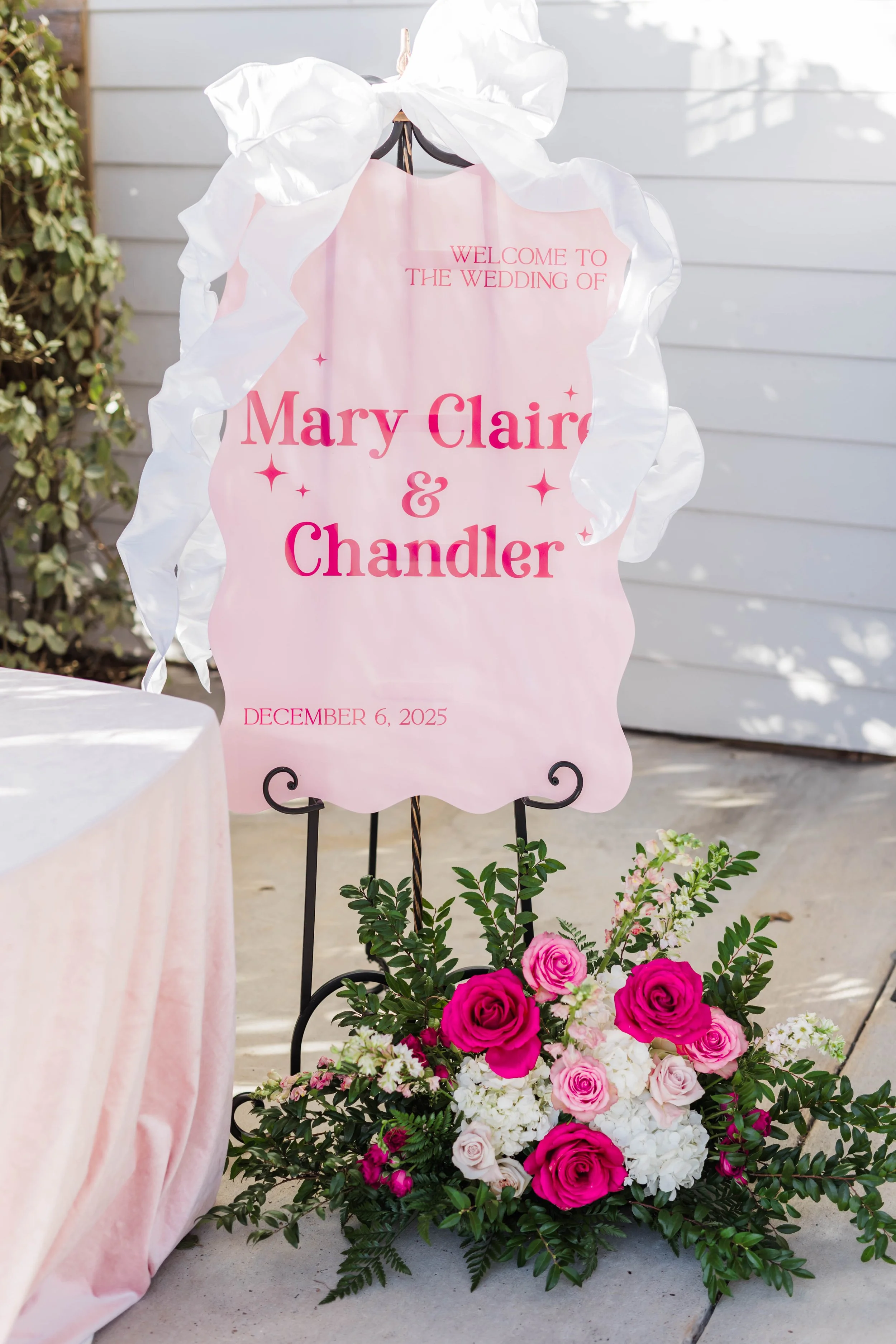 06-hot-pink-scalloped-welcome-sign-with-roses-for-a-december-wedding-at.jpg