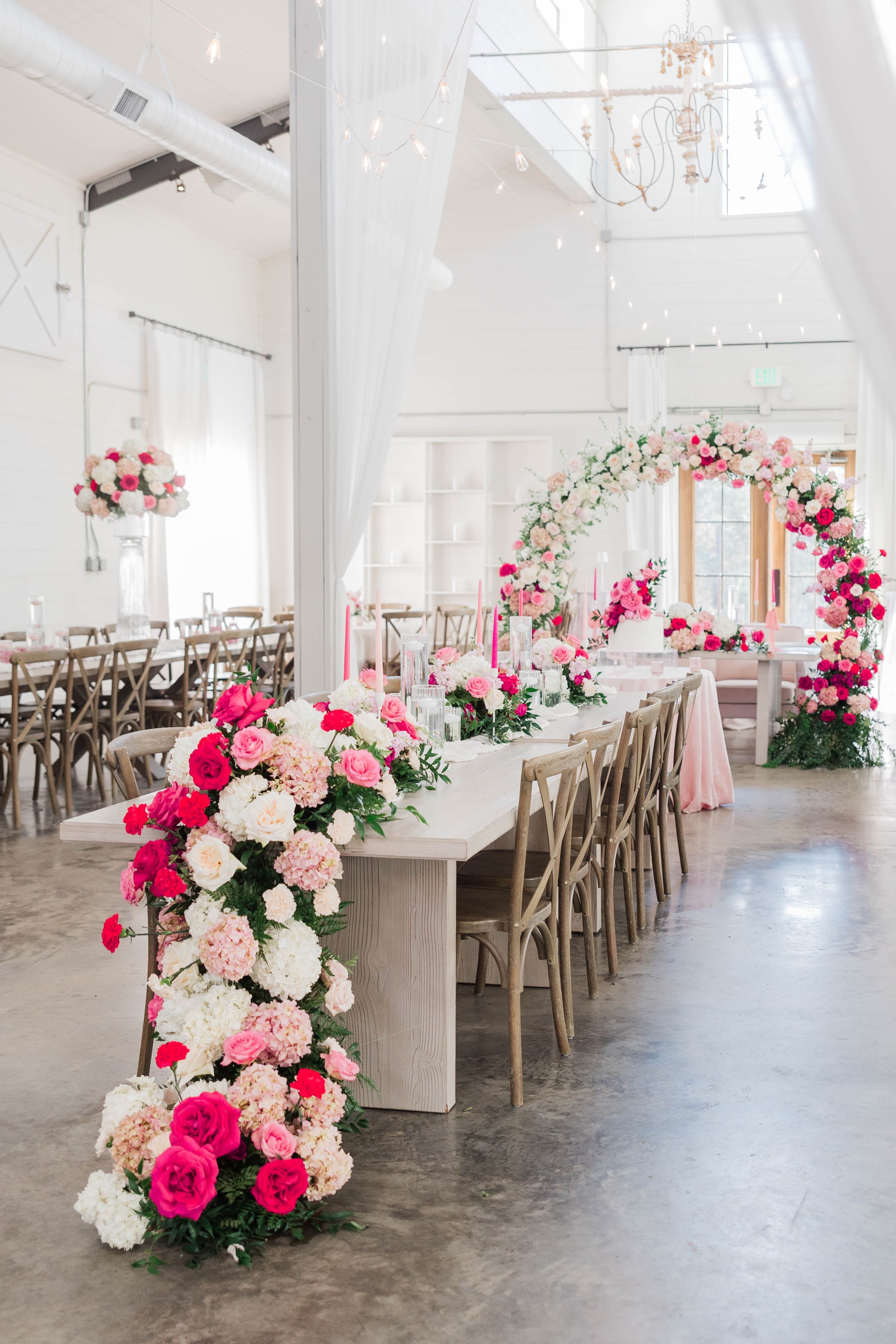 11-reception-tables-with-cascading-pink-florals-at-the-stone-barn-sainte.jpg