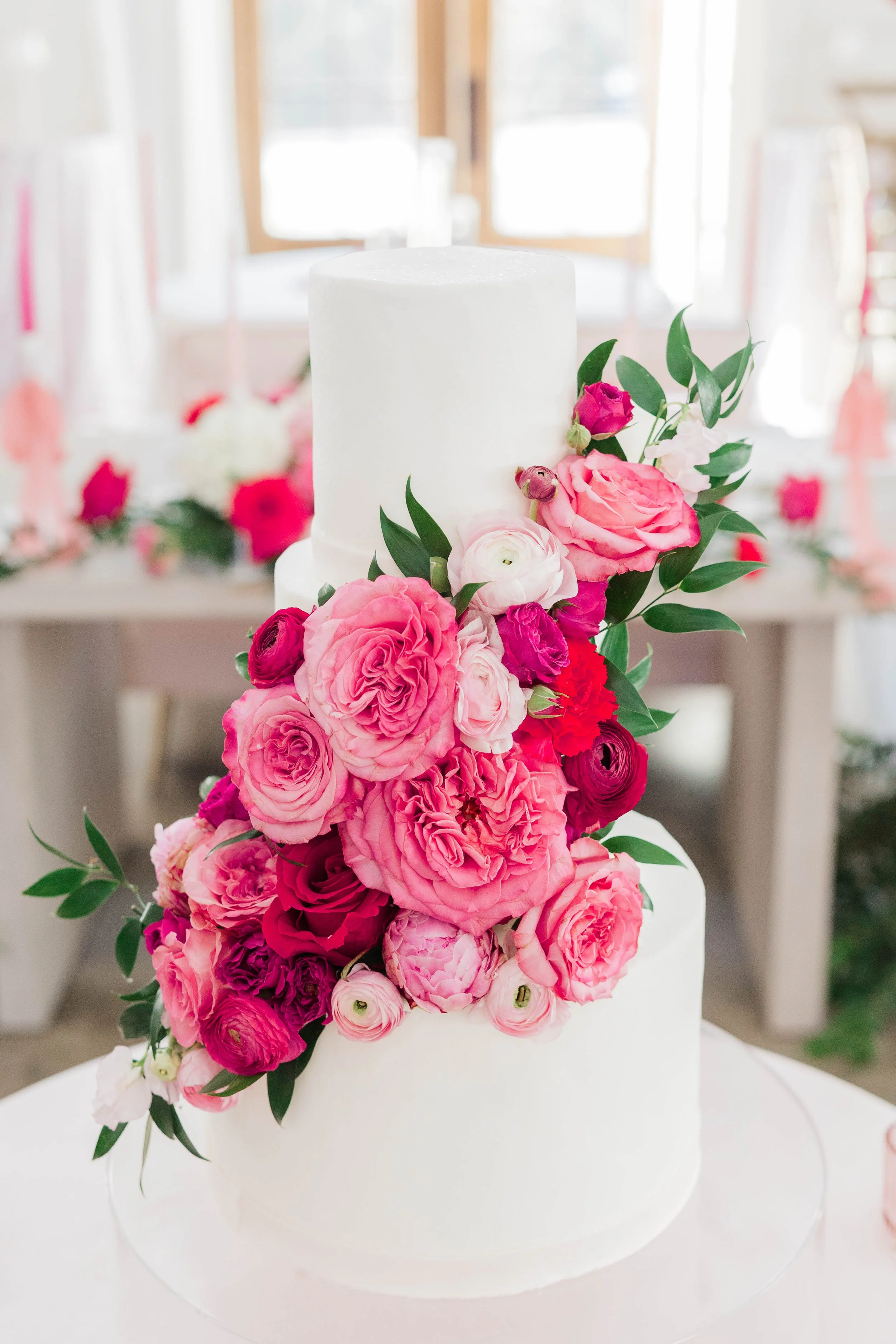 12-white-wedding-cake-with-cascading-hot-pink-and-blush-garden-roses-at.jpg
