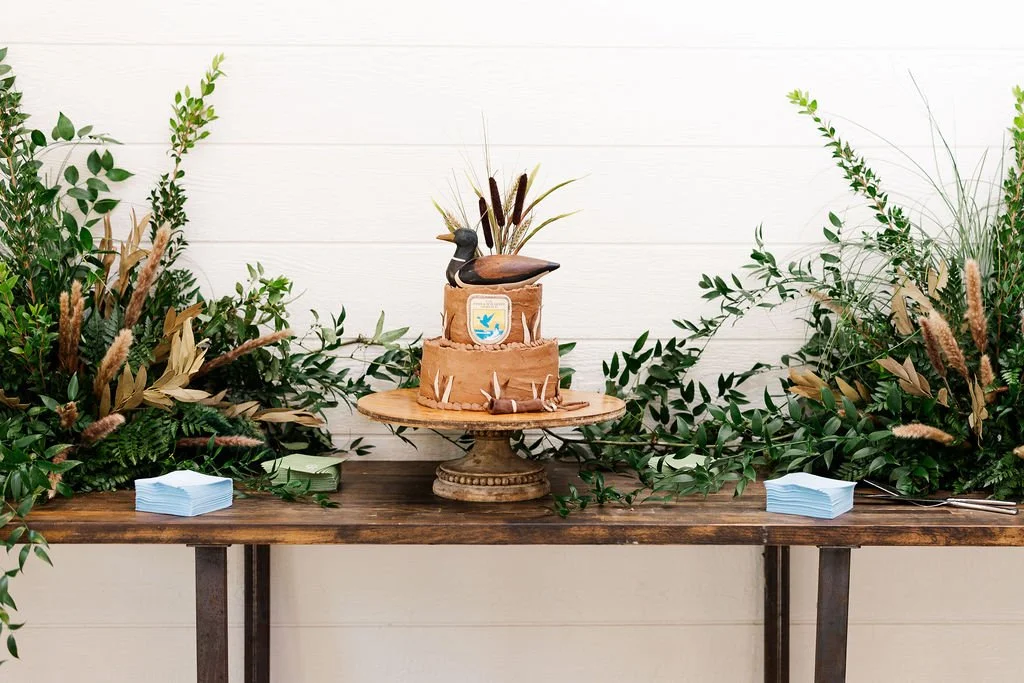 17-groom-s-cake-shaped-as-a-duck-decoy-with-wheat-and-greenery-at-the.jpg