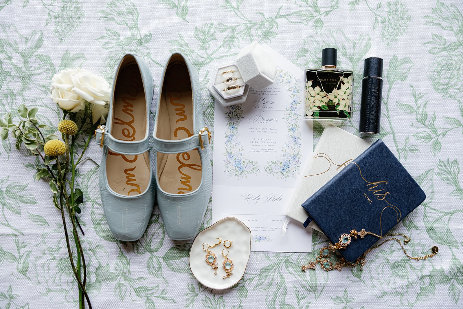 01-blue-embroidered-bridal-shoes-and-invitation-on-green-toile-at-the.jpg