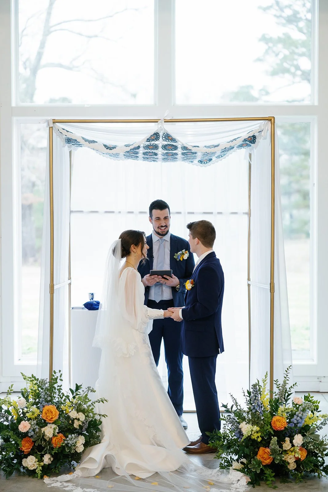 05-bride-and-groom-exchanging-vows-beneath-a-hand-painted-chuppah-at-the.jpg