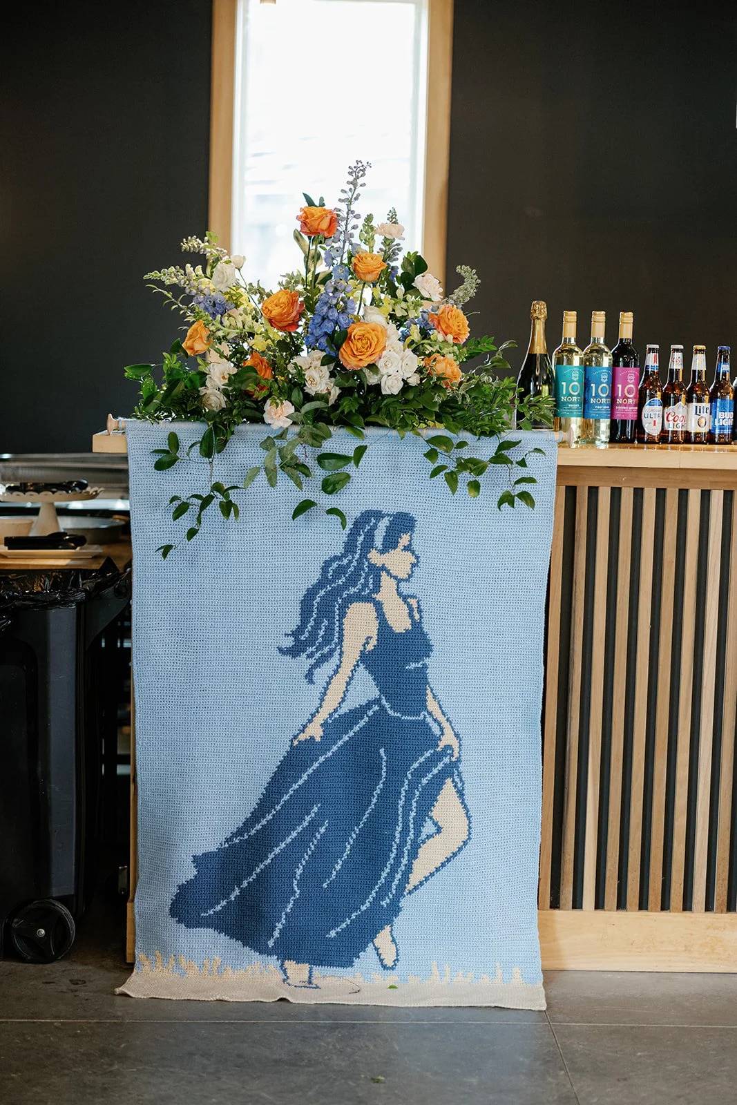 09-hand-made-blue-tapestry-of-the-bride-hanging-from-the-bar-at-the.jpg