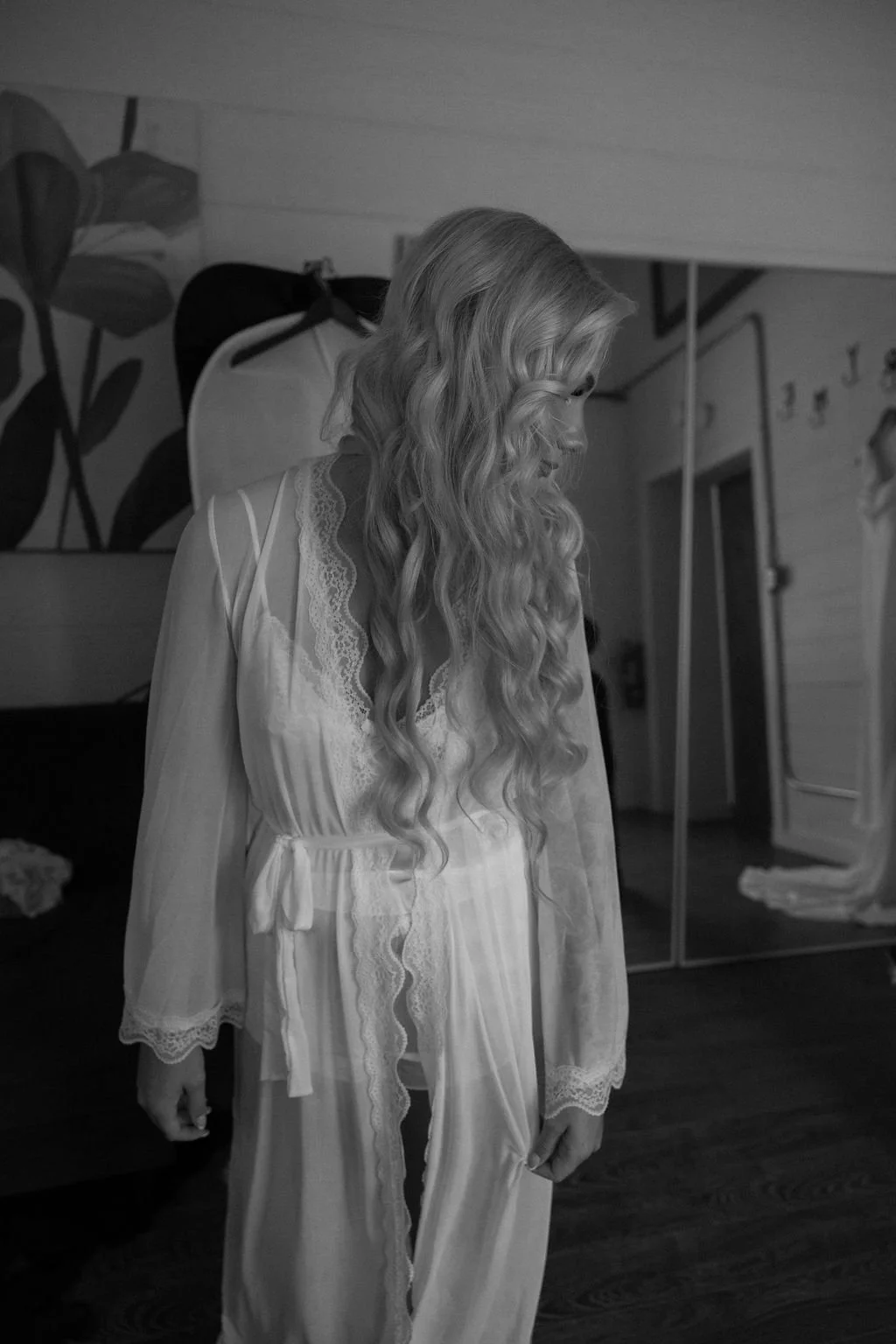 04-black-and-white-photograph-of-the-bride-in-a-lace-robe-before-her-june.jpg