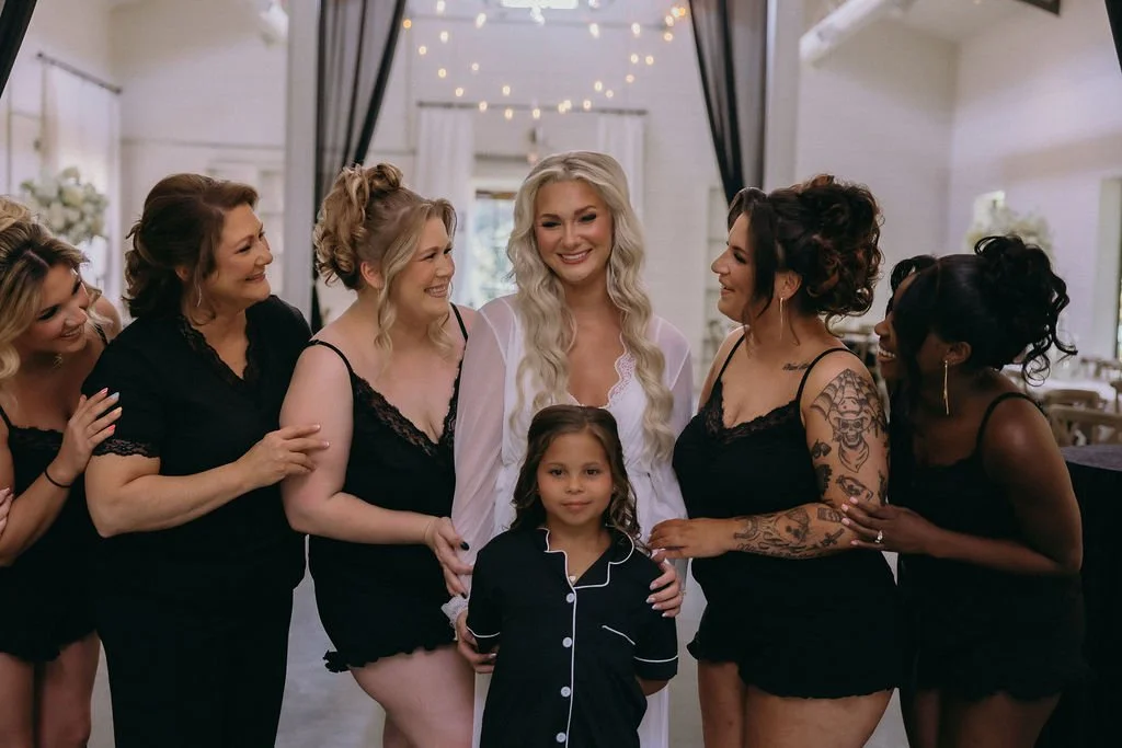 05-bride-with-her-bridesmaids-in-black-pajamas-getting-ready-at-the-stone.jpg