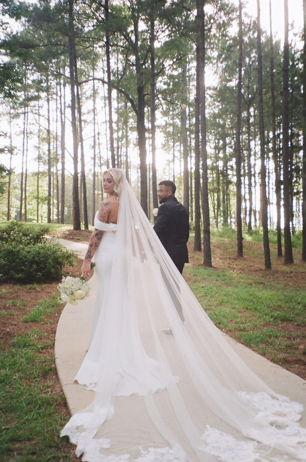 12-film-photograph-of-the-bride-s-cathedral-veil-trailing-down-the-pine.jpg