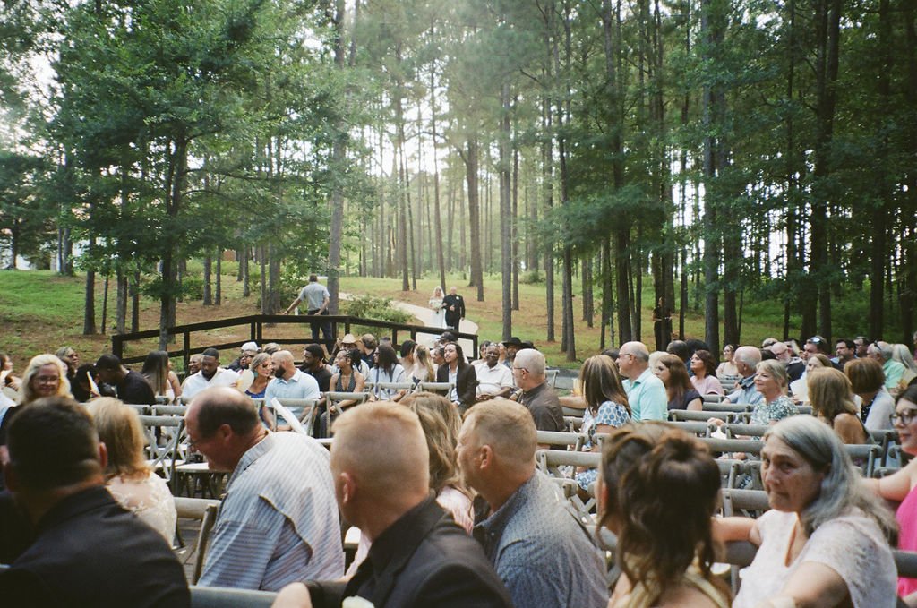 16-guests-seated-in-the-pines-for-an-outdoor-wedding-ceremony-at-the.jpg