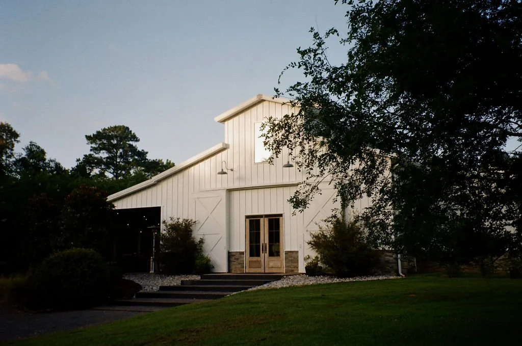 22-the-stone-barn-at-sainte-terre-at-dusk-an-all-inclusive-wedding-venue.jpg