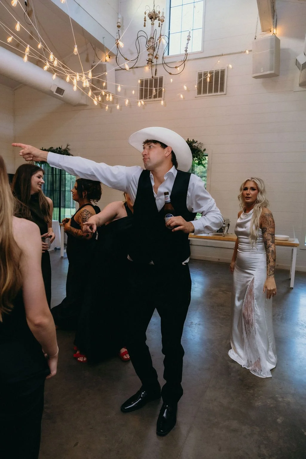 27-bride-in-a-satin-reception-dress-on-the-dance-floor-at-the-stone-barn.jpg