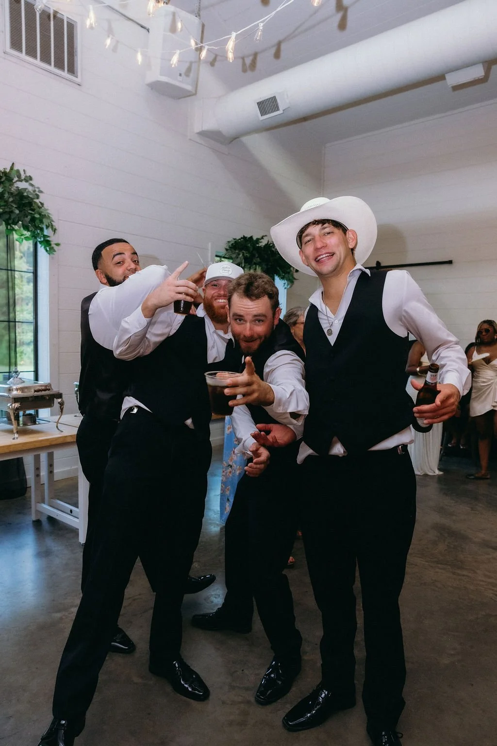 30-groomsmen-in-black-vests-on-the-dance-floor-at-the-stone-barn-at-sainte.jpg