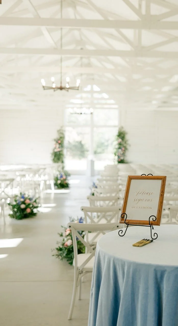 05-wedding-guest-book-table-in-dusty-blue-velvet-in-the-white-chapel-at.jpg