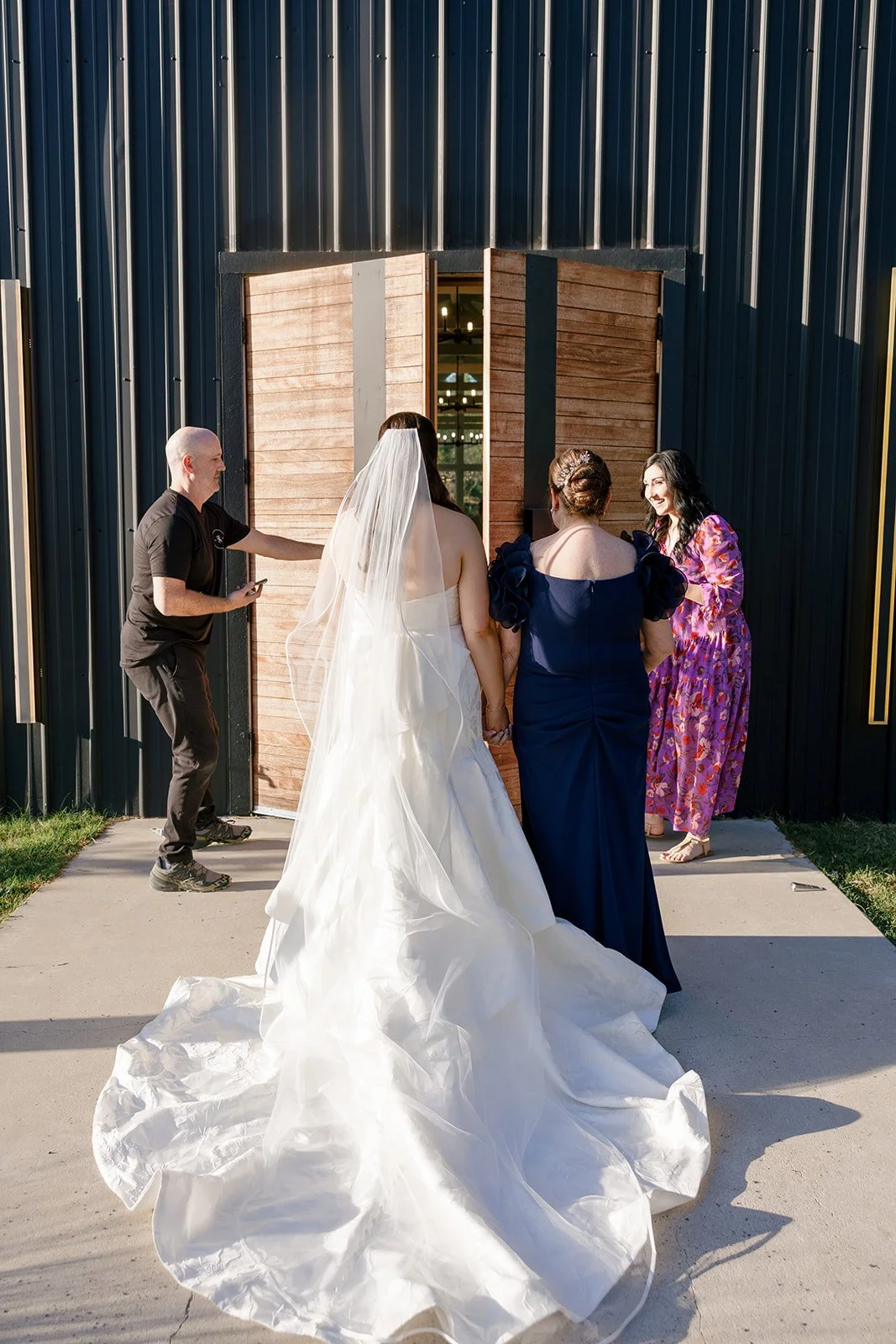 07-bride-waiting-at-the-doors-of-the-stables-before-her-ceremony-at-sainte.jpg