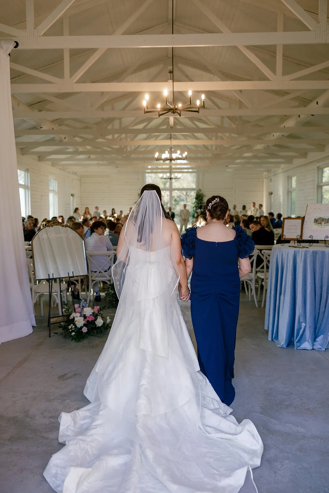08-bride-walking-into-the-white-chapel-with-her-mother-at-the-stables-at.jpg