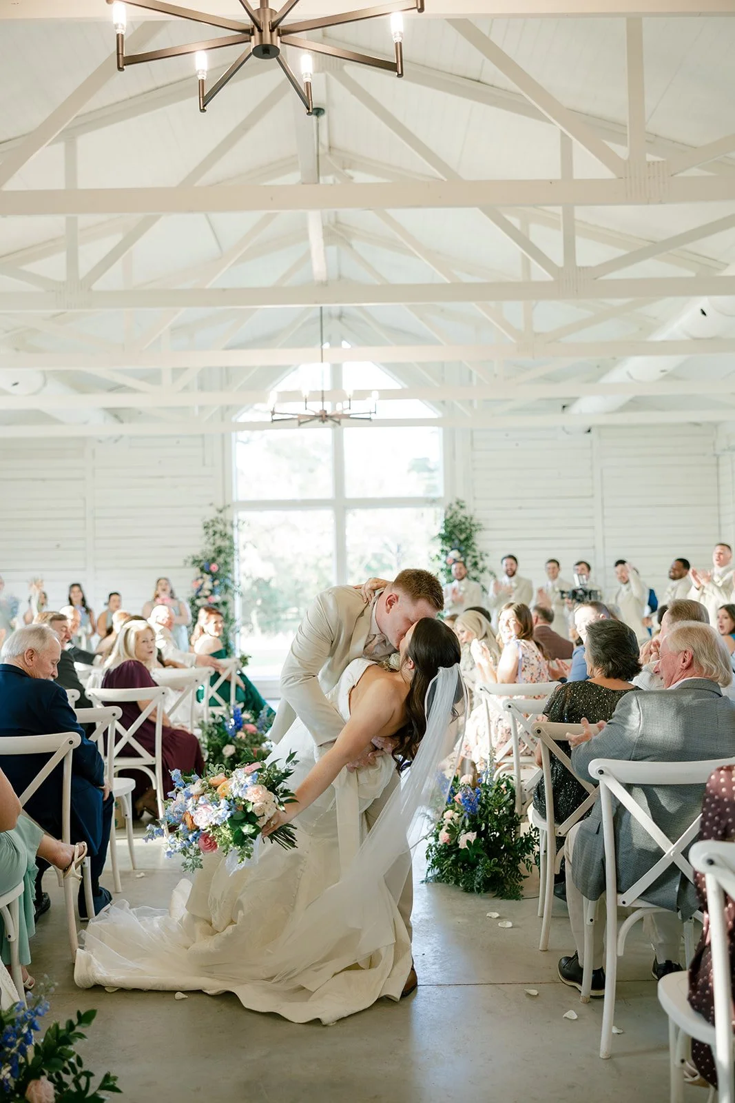 12-first-kiss-in-the-white-chapel-at-the-stables-an-all-inclusive-wedding.jpg