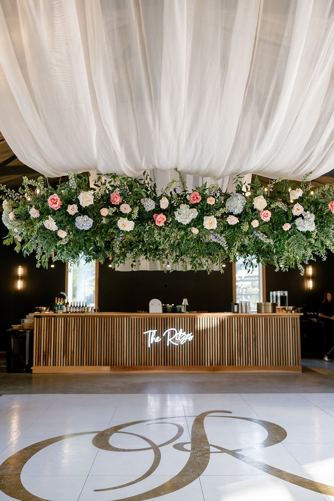 17-suspended-floral-installation-over-the-bar-and-a-monogrammed-dance.jpg