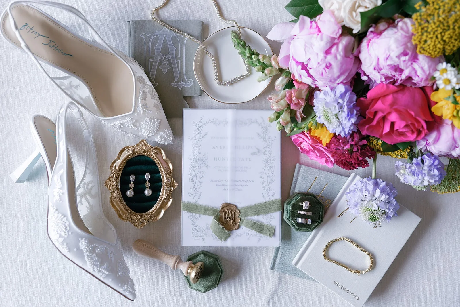01-wedding-flat-lay-with-lace-heels-invitation-suite-and-a-bright-summer.jpg