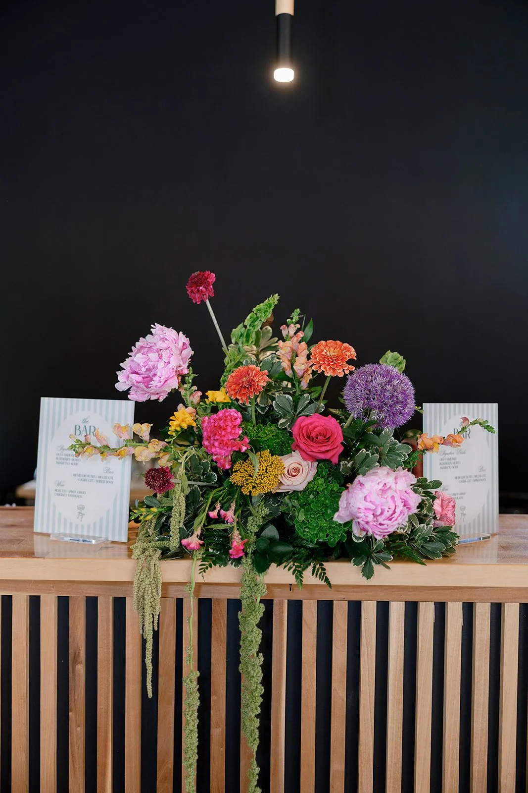 04-bright-summer-bar-arrangement-with-peonies-zinnias-and-allium-at-the.jpg