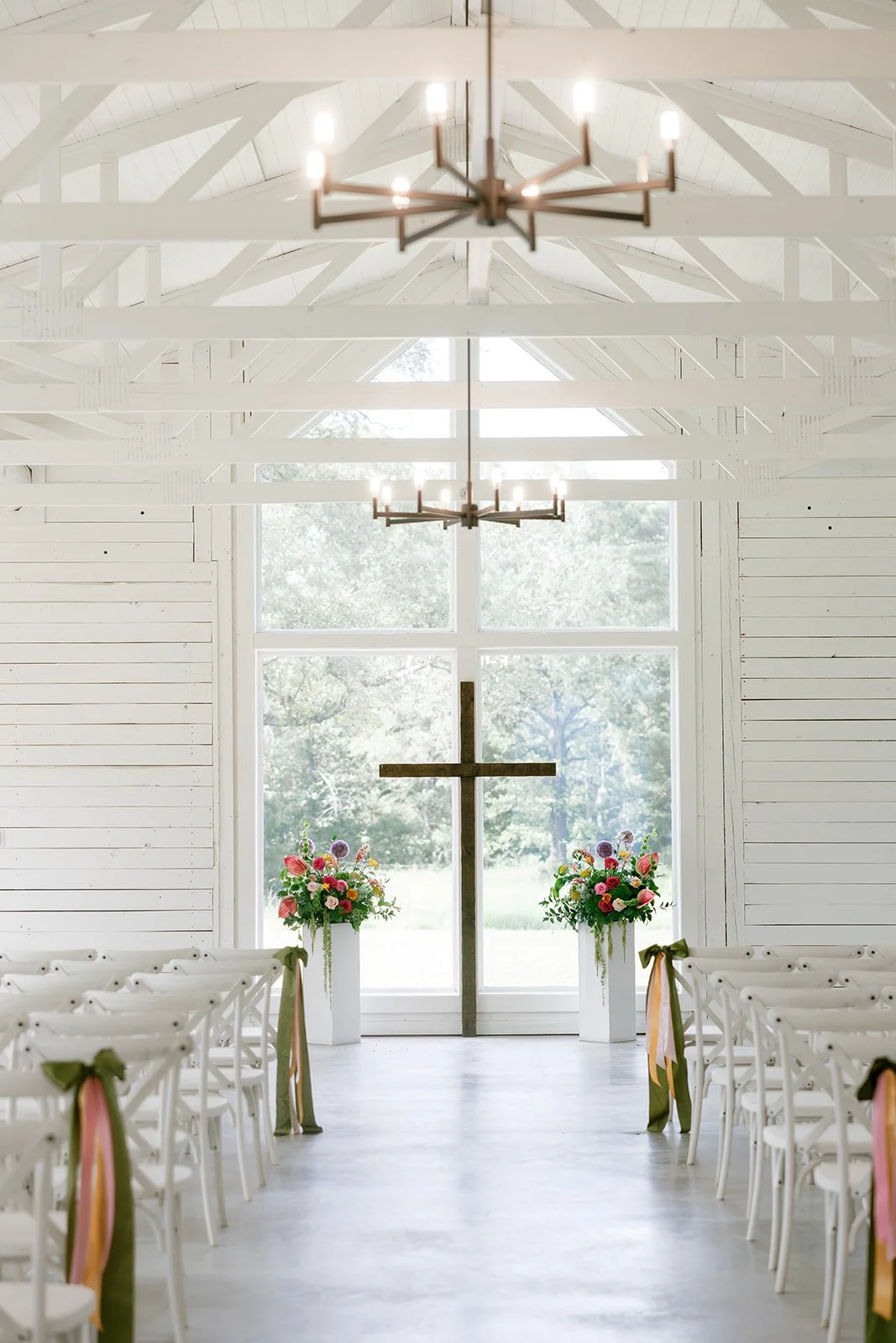 07-the-white-chapel-at-the-stables-set-for-a-june-wedding-ceremony-with.jpg