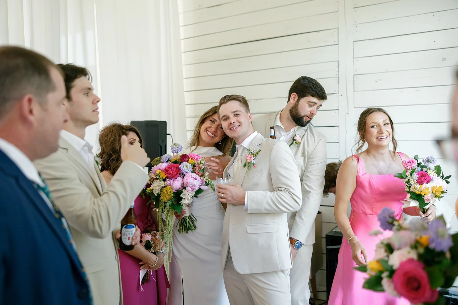 14-bride-and-groom-with-their-wedding-party-at-the-reception-at-the.jpg