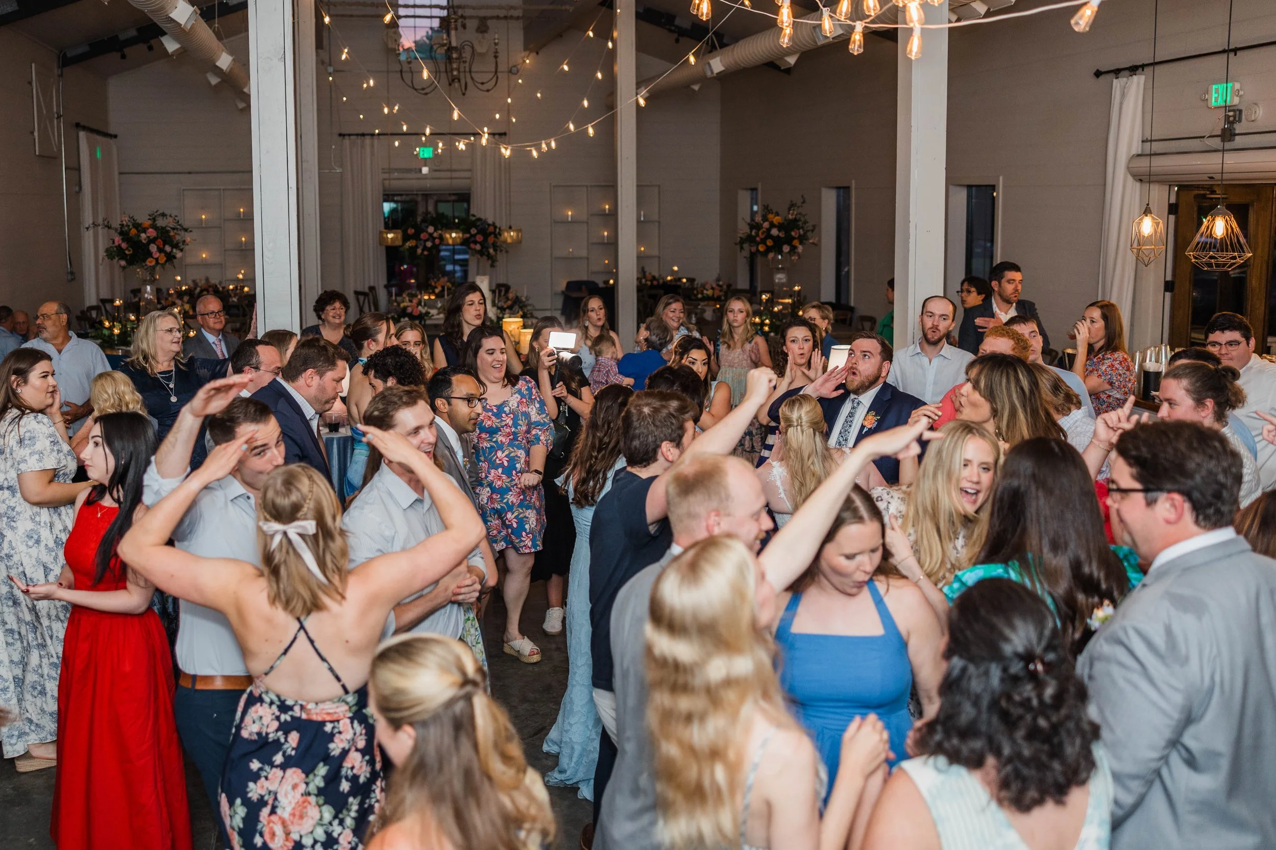11-packed-dance-floor-under-string-lights-at-a-may-wedding-reception-at.jpg
