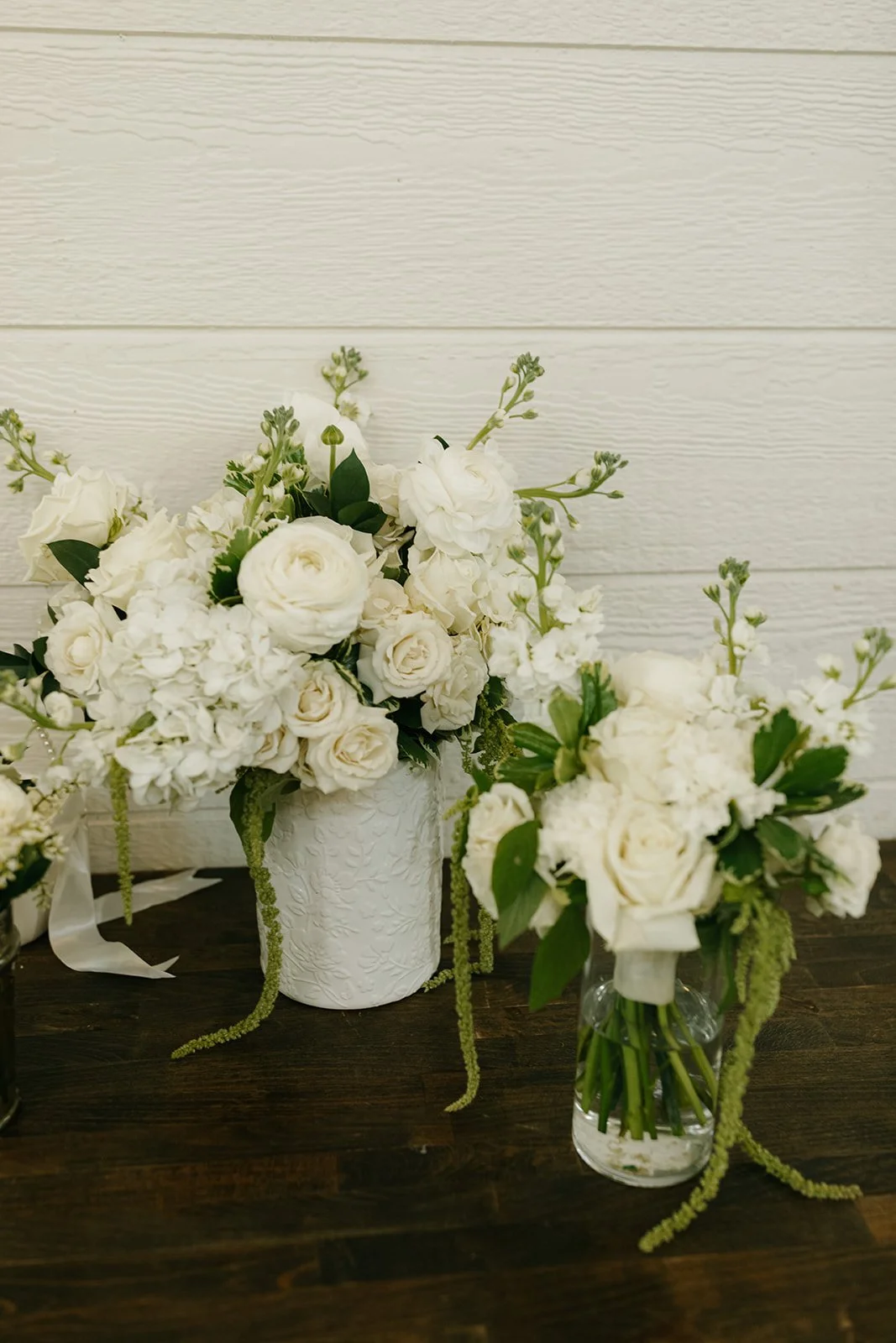 05-white-bridesmaid-bouquets-with-hanging-amaranthus-resting-in-vases-at.jpg