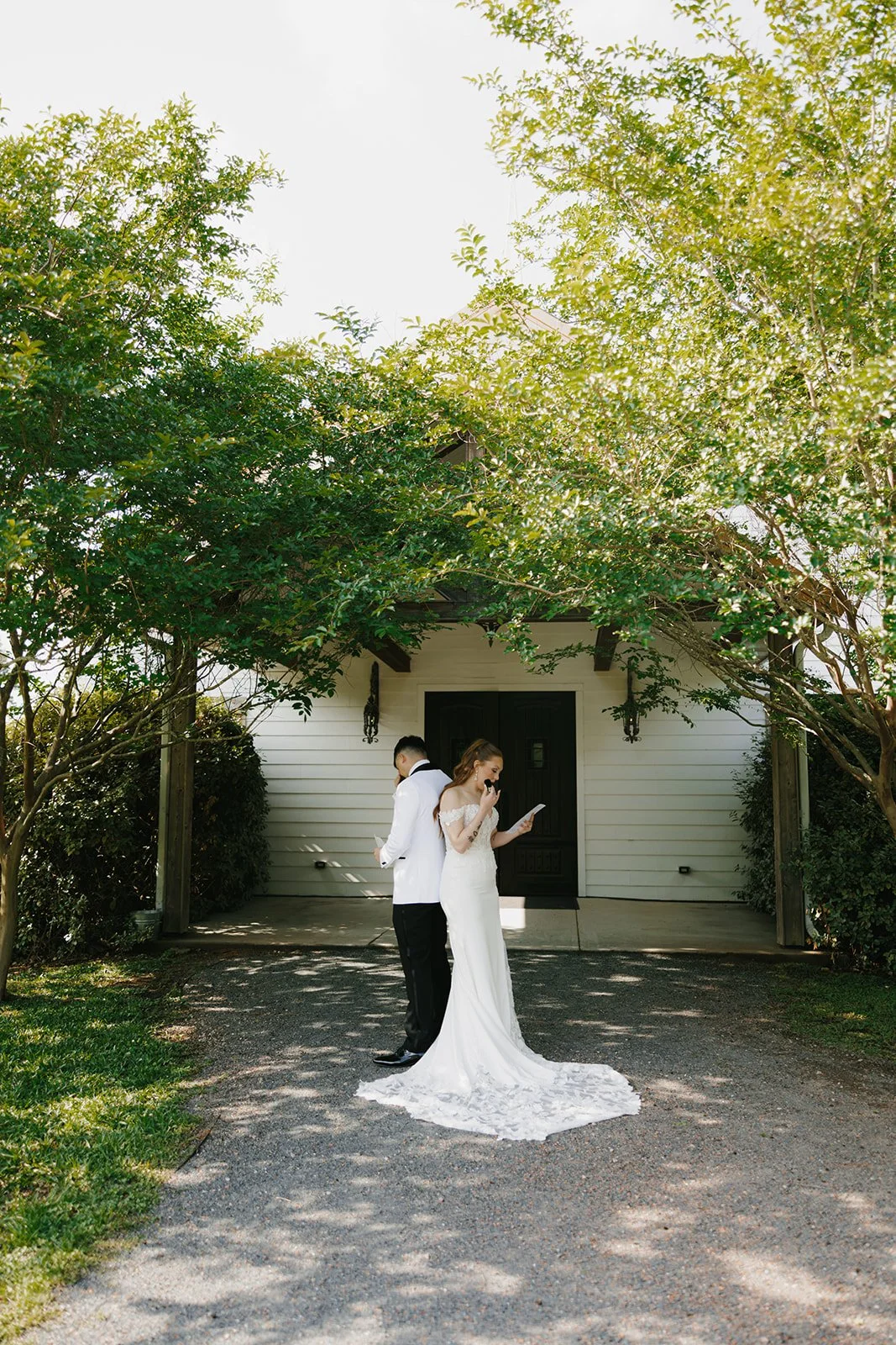 11-bride-and-groom-reading-letters-back-to-back-under-crepe-myrtles-before.jpg