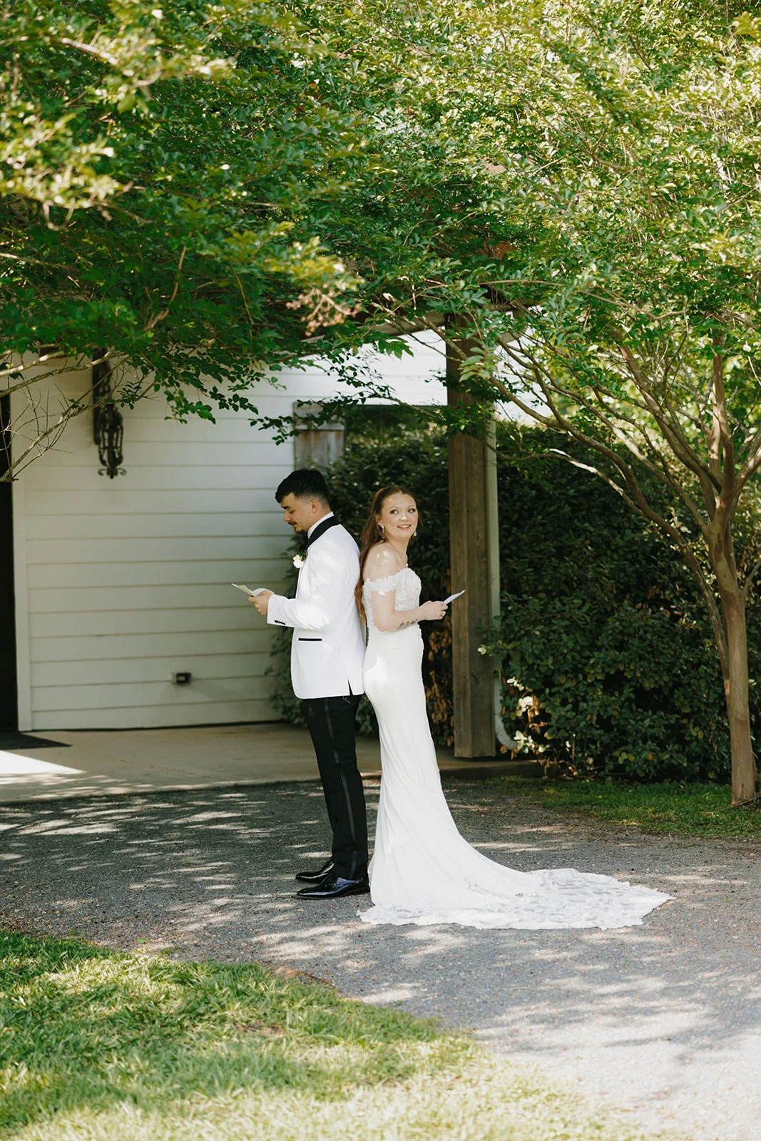 12-bride-smiling-over-her-shoulder-during-a-back-to-back-letter-reading-at.jpg