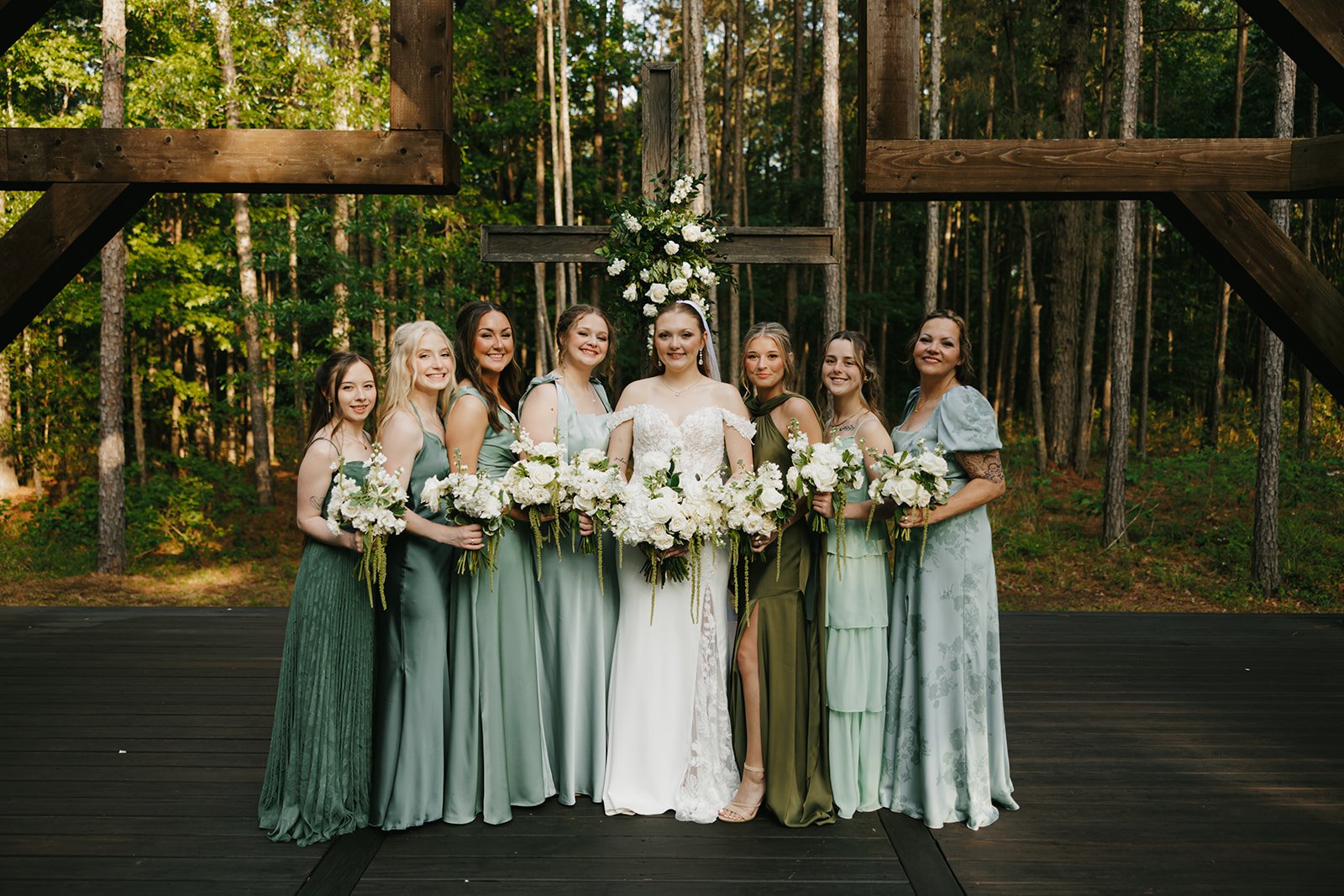 15-bride-with-her-bridesmaids-in-mismatched-sage-olive-and-emerald-dresses.jpg