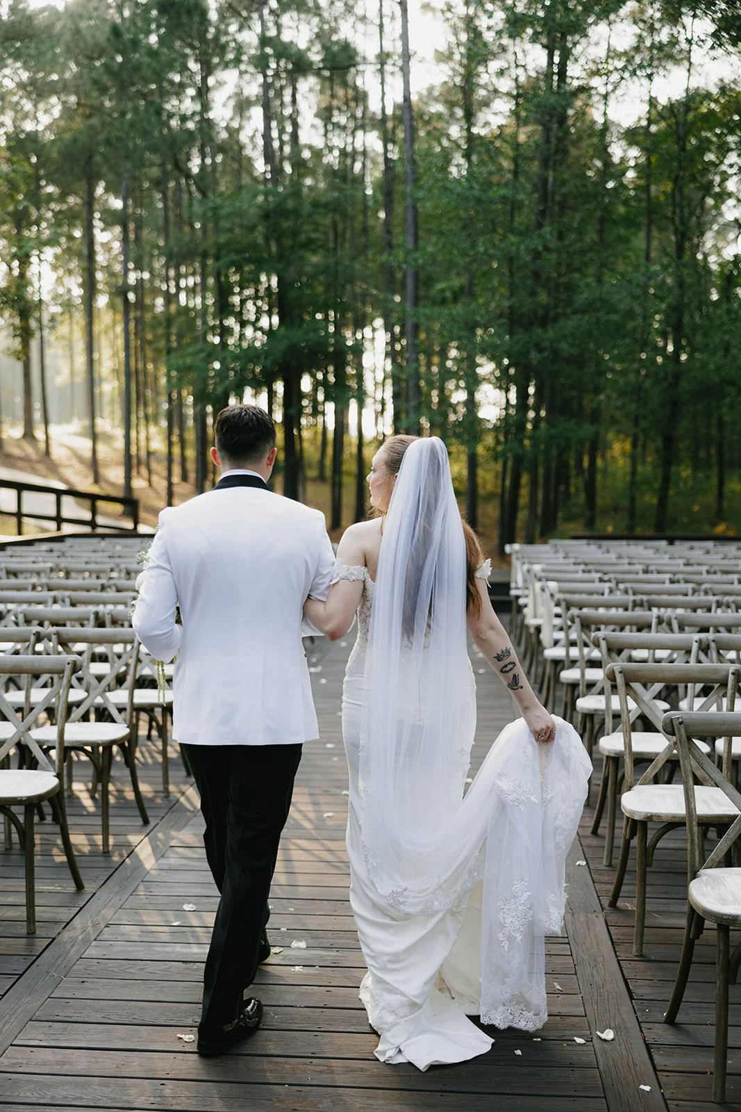 17-bride-and-groom-walking-up-the-empty-aisle-of-the-sanctuary-among-the.jpg
