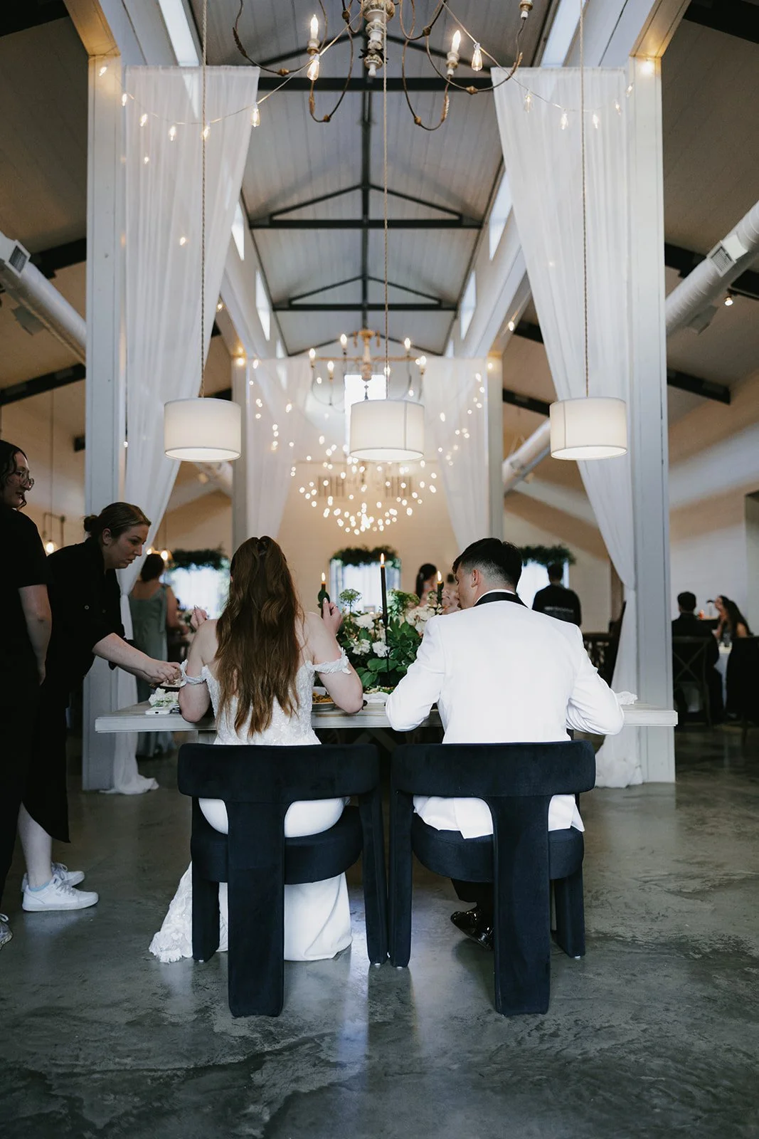 20-bride-and-groom-served-dinner-at-a-sweetheart-table-with-black-velvet.jpg