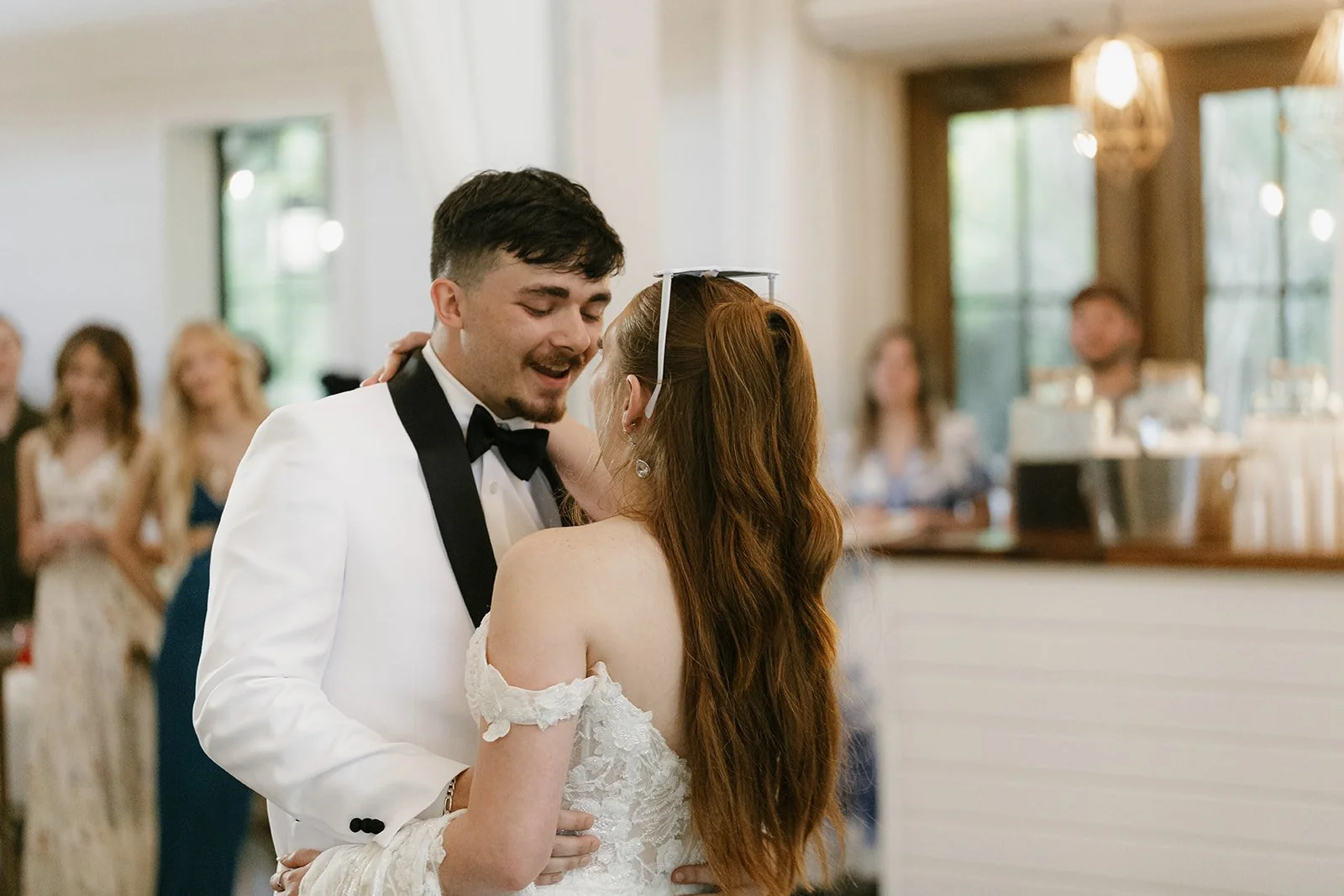 21-groom-singing-to-the-bride-during-their-first-dance-at-the-stone-barn.jpg