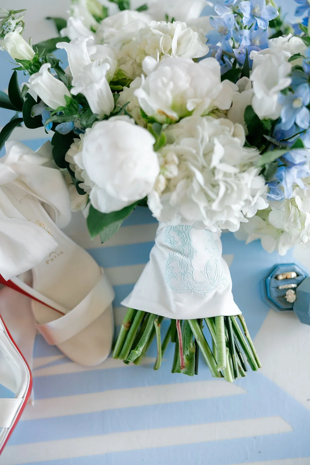 02-bridal-bouquet-of-white-peonies-hydrangea-and-blue-delphinium-wrapped.jpg