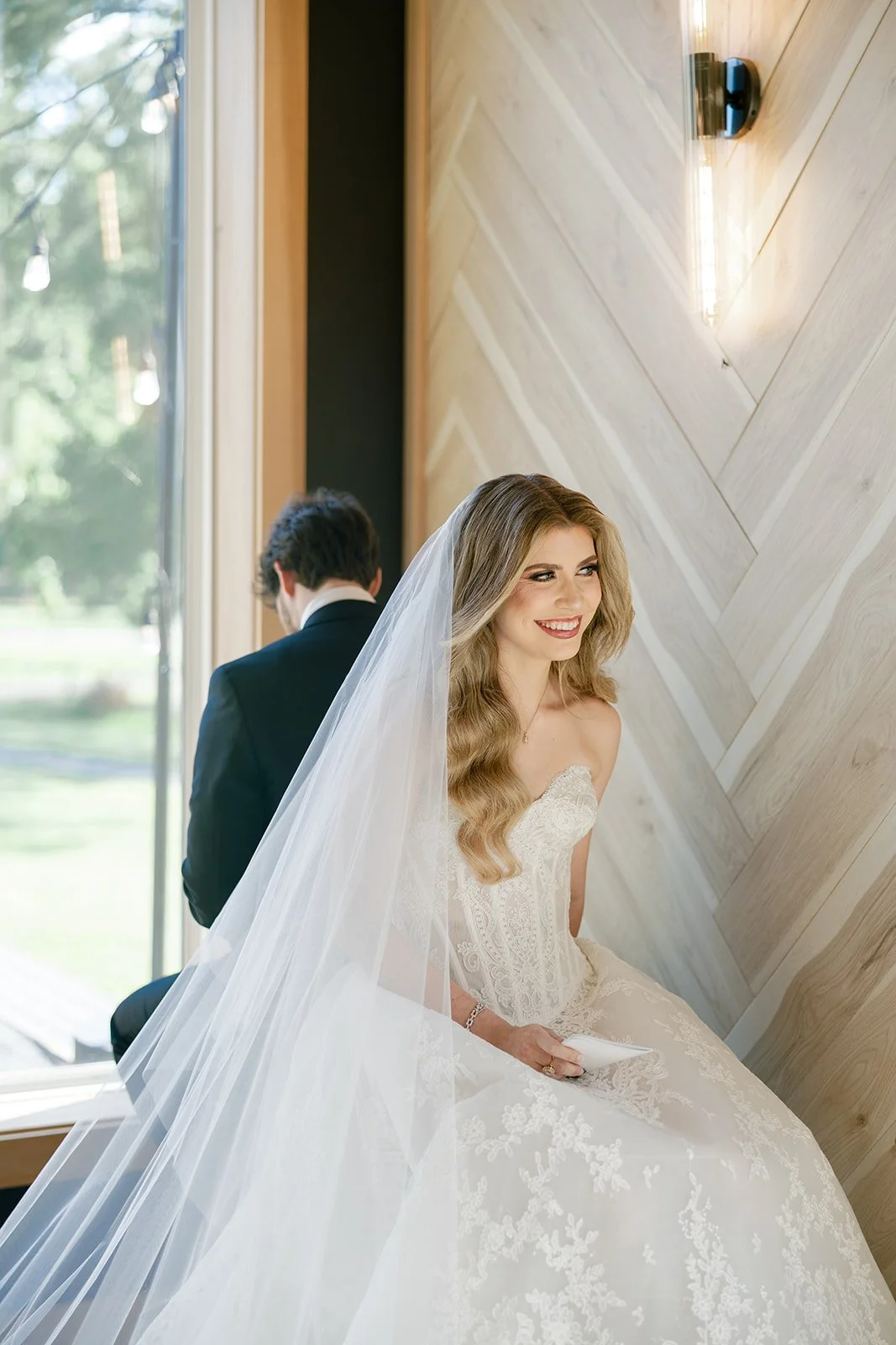 05-bride-in-a-cathedral-veil-smiling-during-private-vows-at-the-stables-at.jpg
