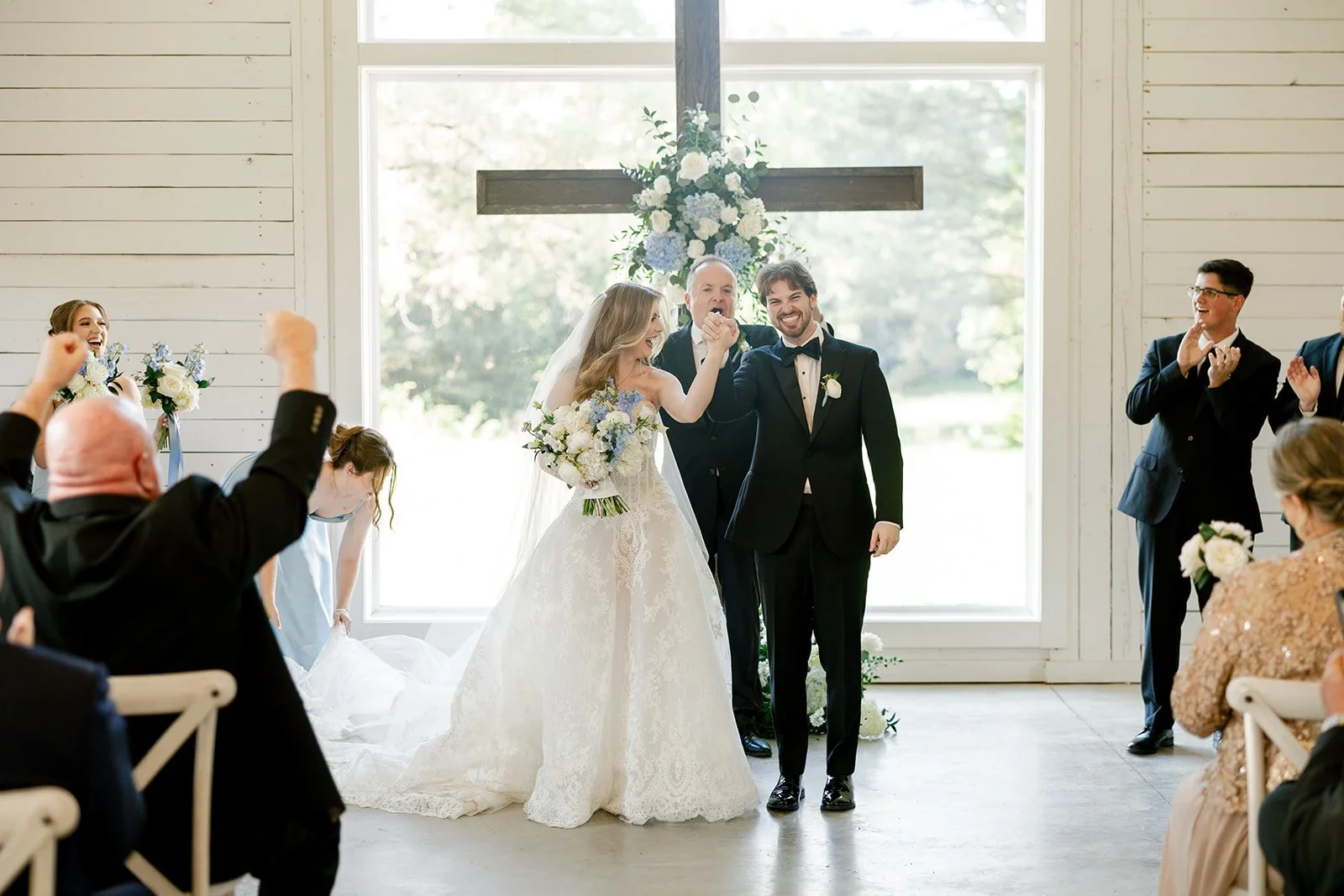 11-bride-and-groom-announced-as-married-while-guests-cheer-in-the-chapel.jpg