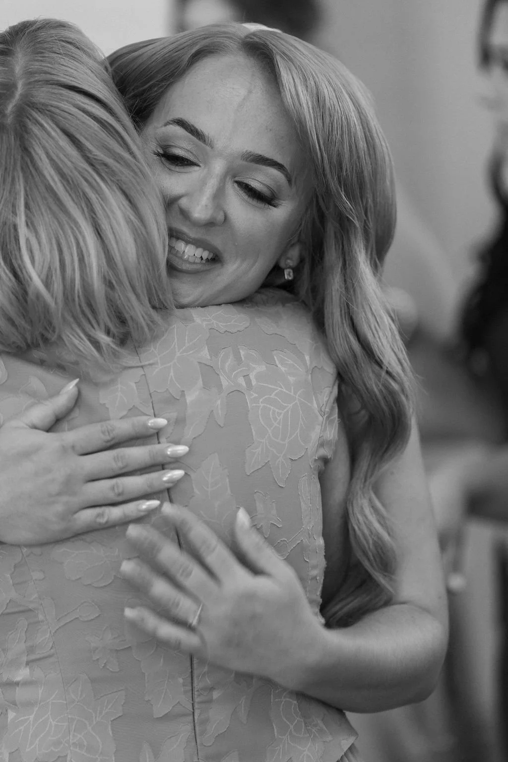 06-bride-in-a-long-embrace-before-her-wedding-at-the-stone-barn-at-sainte.jpg