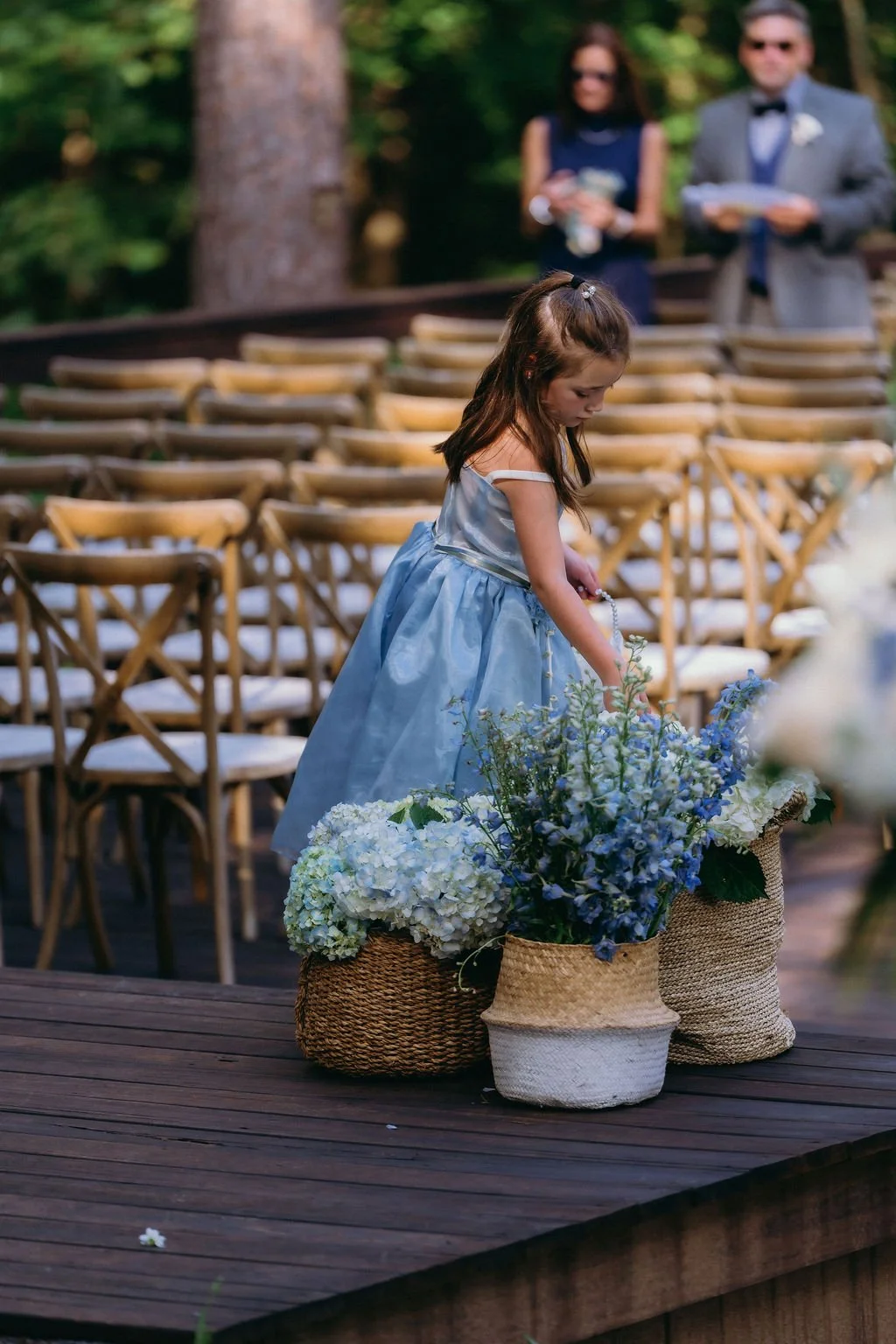 18-flower-girl-in-baby-blue-beside-baskets-of-hydrangea-in-the-sanctuary.jpg