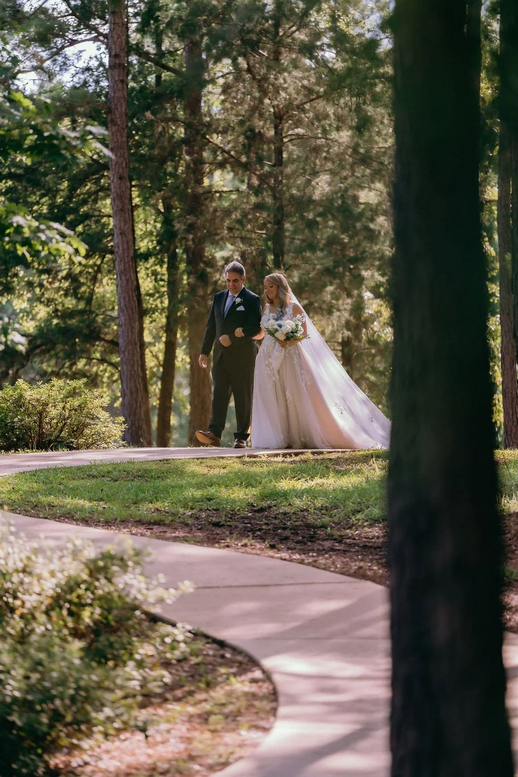 19-father-walking-the-bride-through-the-pines-to-the-sanctuary-at-the.jpg