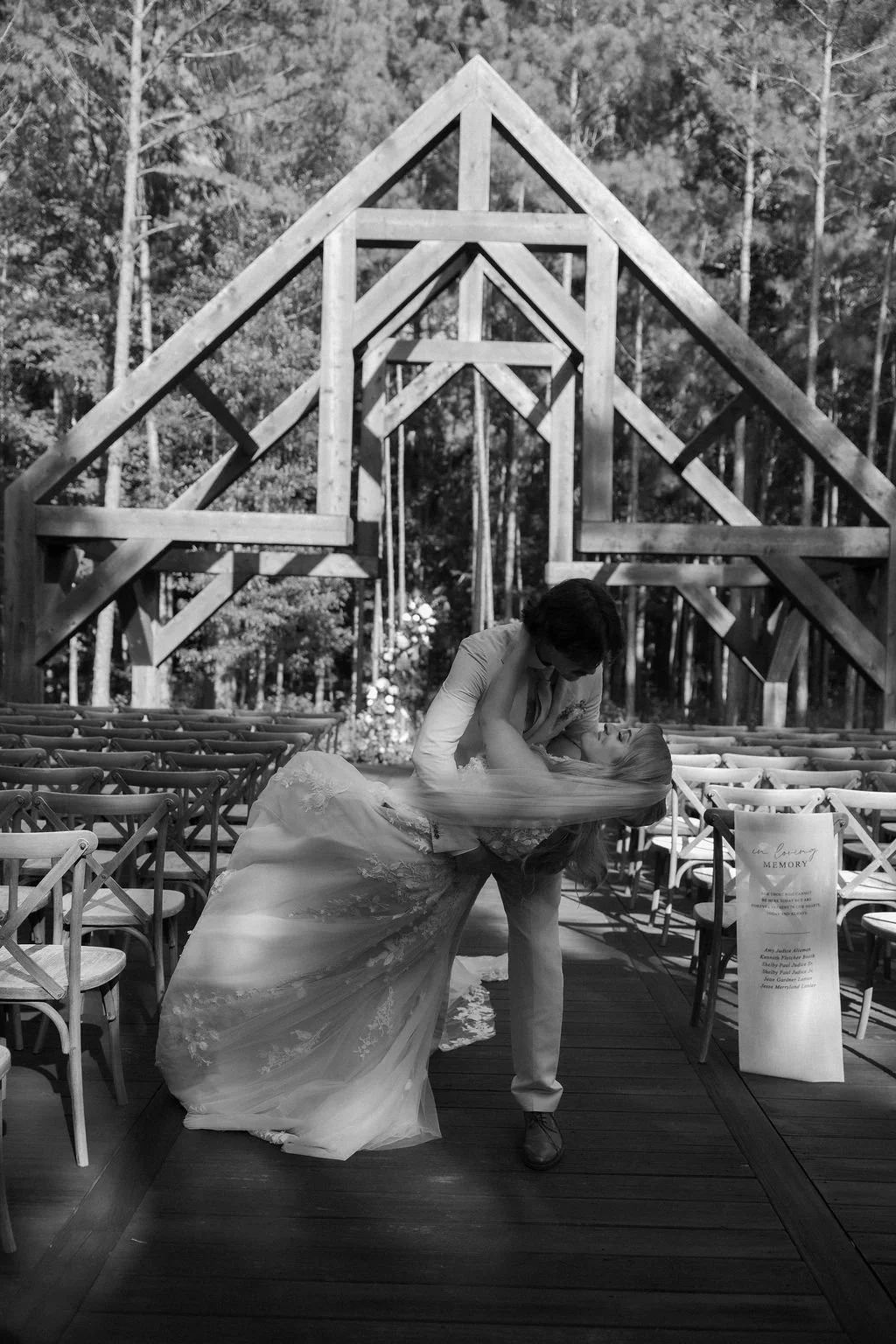 24-groom-dipping-the-bride-in-the-aisle-of-the-sanctuary-open-air-chapel.jpg