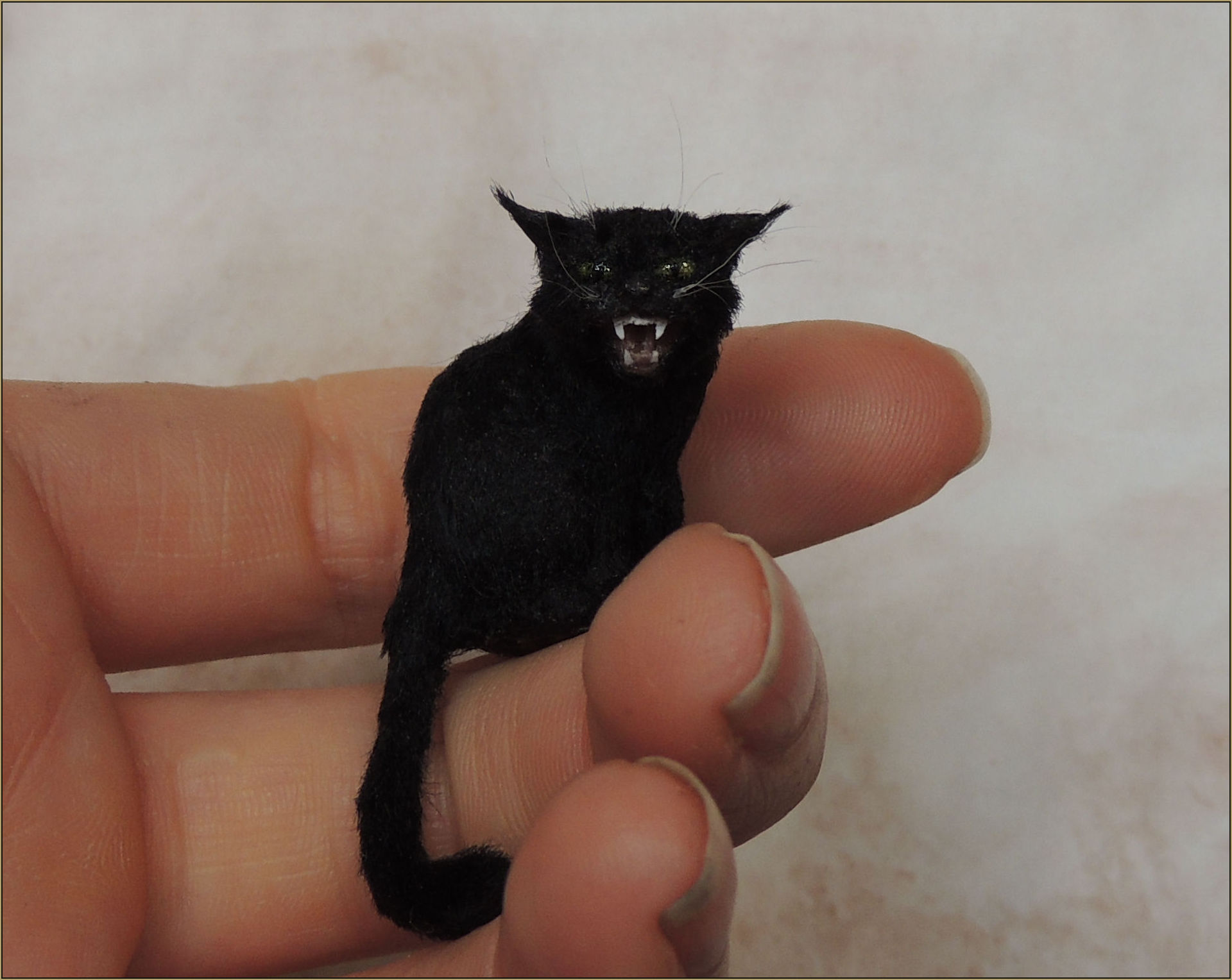     Scale: 1:12th    Medium: Polymer clay mixed media with a coat made of black viscose yarn. The eyes are hand painted.    Dimensions: 2.8 cm from base to the top of the head. 4.8cm Including the length of the tail.    Year: 2015    