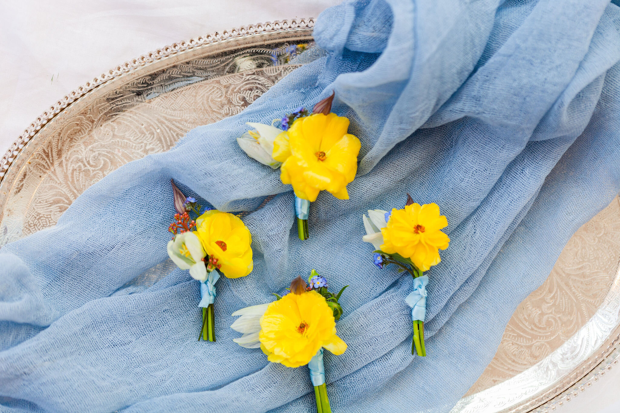 Spring Wedding Buttonholes: Yellow Butterfly Ranunculus, Frittilaria and Myosotis