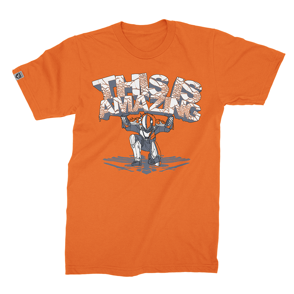 Destiny 2: Shaxx 'Amazing' T-Shirt This shirt is as "Amazing!" as the Lord Shaxx himself. He's cheered you to victory and chided you in defeat. Now, he wants to command your sense of style. Concept by Elliott Gray, support provided for character line art in Adobe Illustrator.