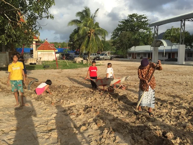 Grandmother working with the sand.JPG
