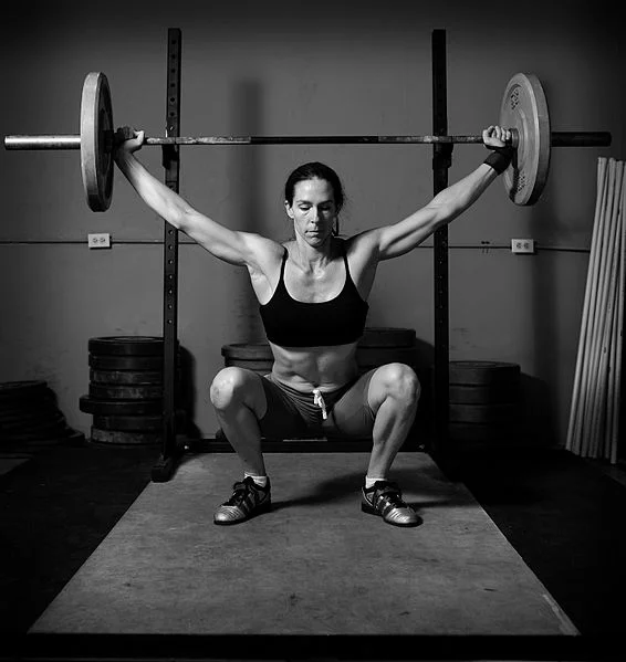 566px-Weight_lifting_black_and_white