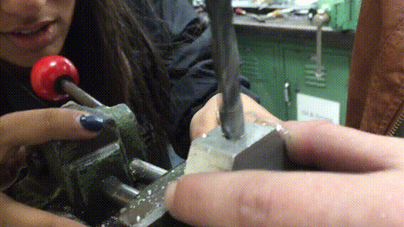 Two of the four on our electronic/pneumatic subsystem drilling holes into the pneumatic manifold